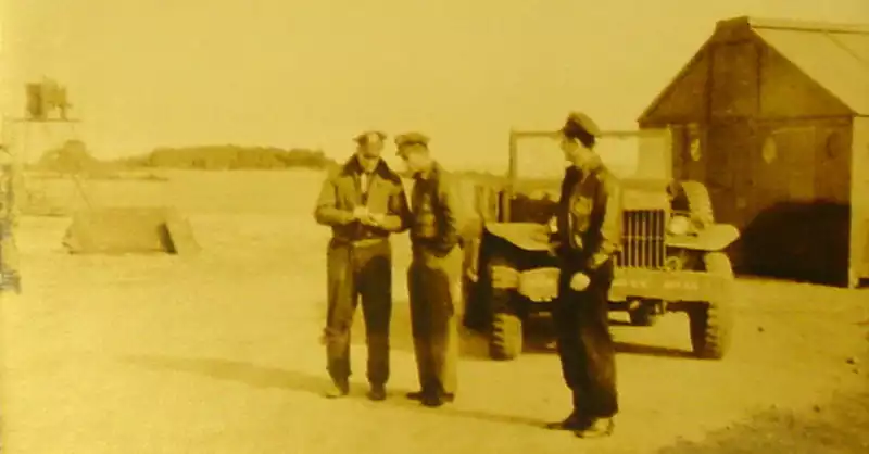 Three officers outside the briefing shack. Photo by Quentin Kaiser.