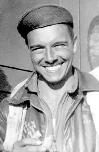 Quentin Kaiser eating a donut supplied by the American Red
Cross after a mission.