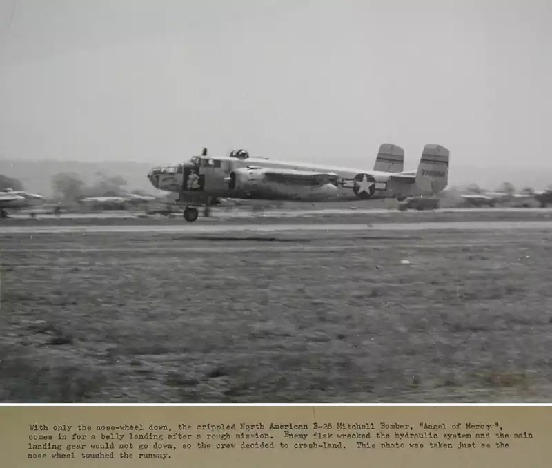Its landing gear damaged by flak, Angel of Mercy comes in for a crash landing.
