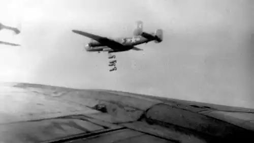 Picture of B-25 9X 'Queen Mary' 
releasing four 1000-pound bombs on a mission.