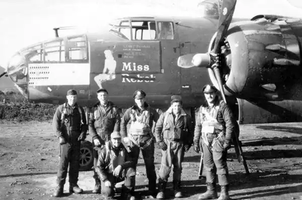 Quentin Kaiser, kneeling, and crew for mission# 63 on B-25J 9V 'Miss Rebel' on January 31, 1945.