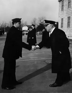 CAPT Fisher presents citation at inspection to YN2c David Kaplan March 10, 1945