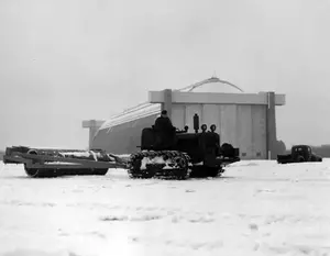 Compacting snow in front of Hangar 2 after heavy snowfall February 16, 1945