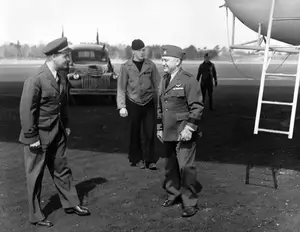 LCDR Pear greeting CDR Mills on inspection visit March 17, 1945