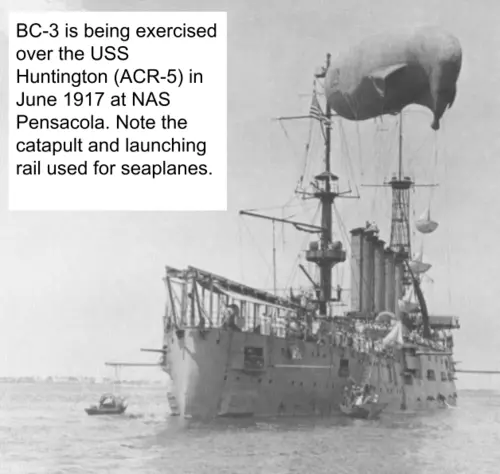 The BC-3 is flying over the USS Huntington.